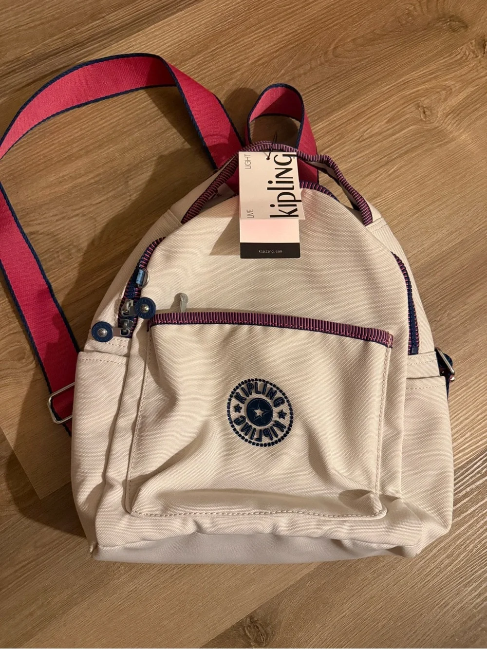 Kipling Cream Kids Backpack with Purple Trim and Blue Charm
